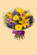 Bouquet of yellow and purple flowers with a purple ribbon on a beige background
