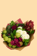 Bouquet of flowers with green apples and white flowers on a beige background