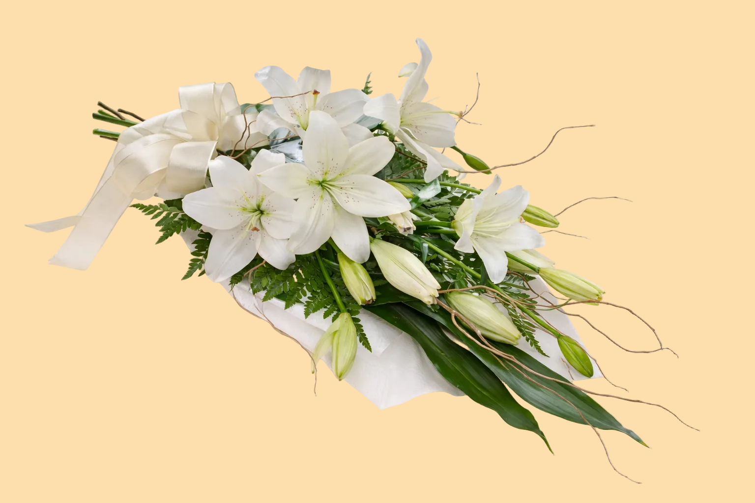 Bouquet of white lilies with green leaves on a beige background